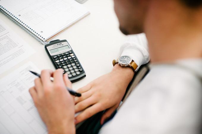 Man using calculator